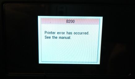 the B200 code apparently indicates a burned-out ink cartridge (guh?), and it just needs replacing (which one?)