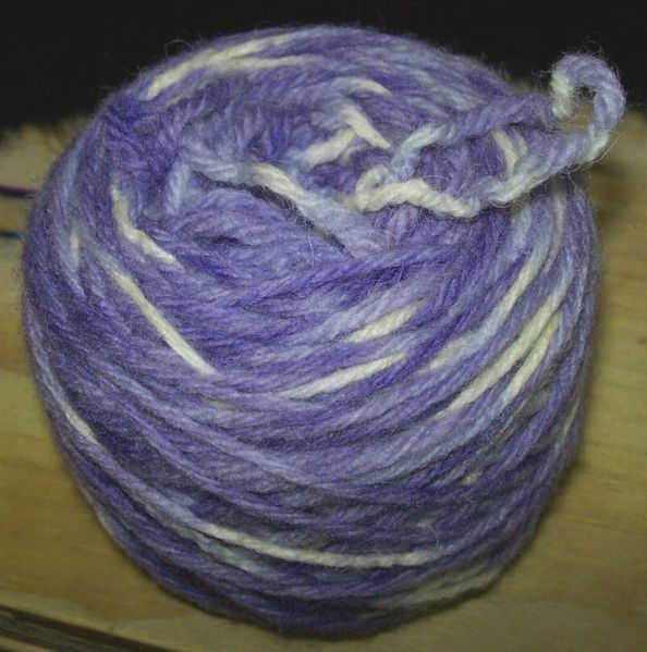 File:Tie dye lavender yarn cake with kestra.jpg